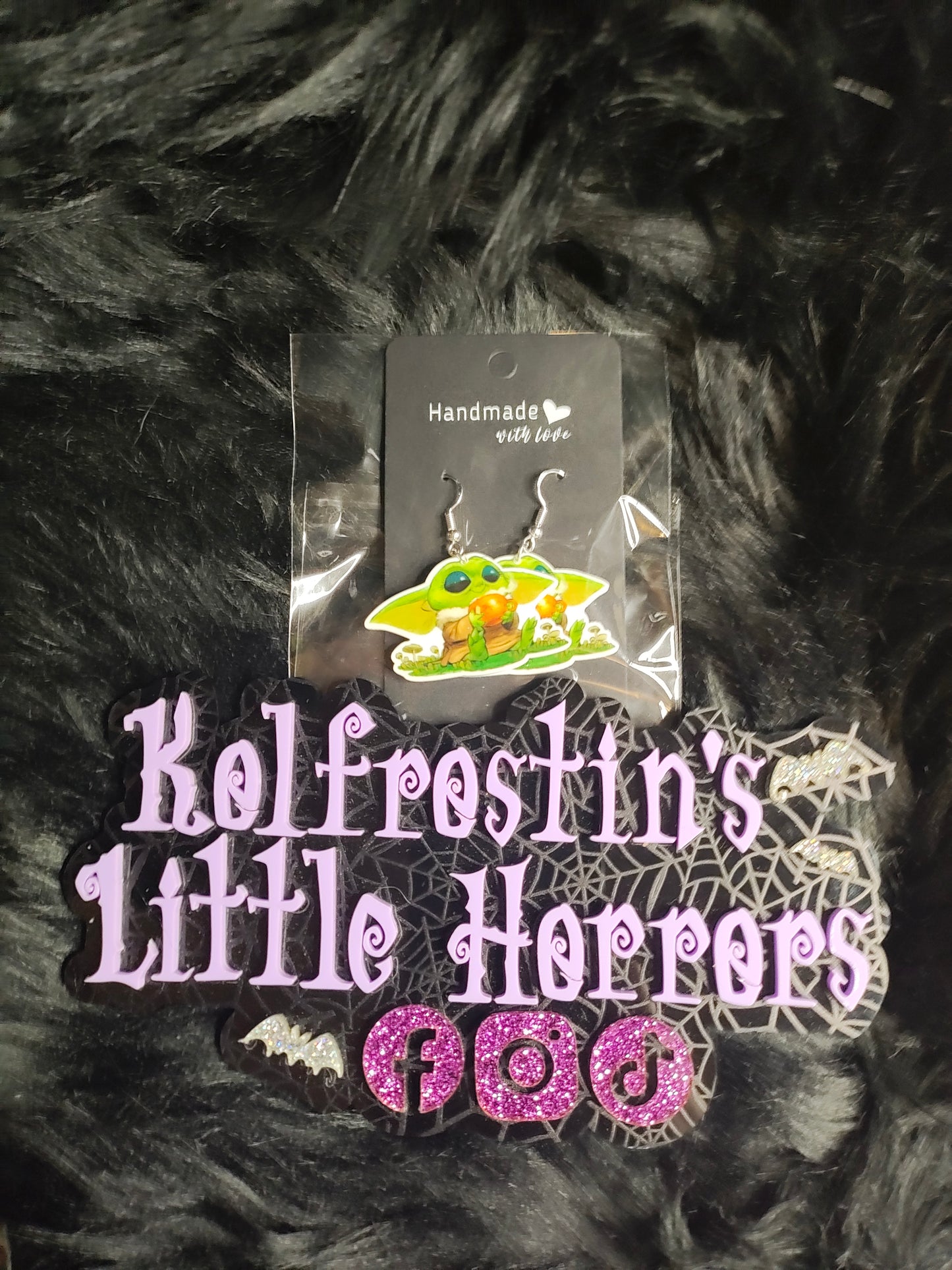 Little green baby with orange